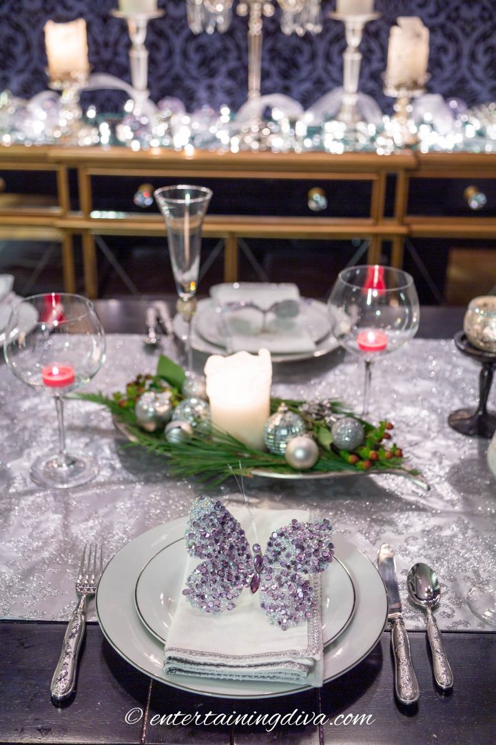 Silver and white Christmas table setting with an easy and elegant Christmas centerpiece