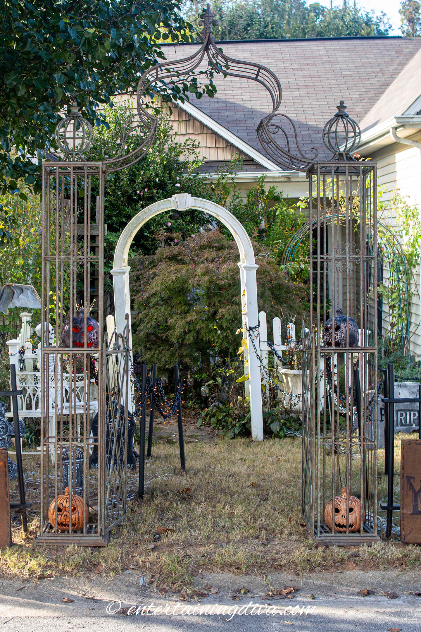 Metal garden arbor used as a Halloween cemetery archway entrance