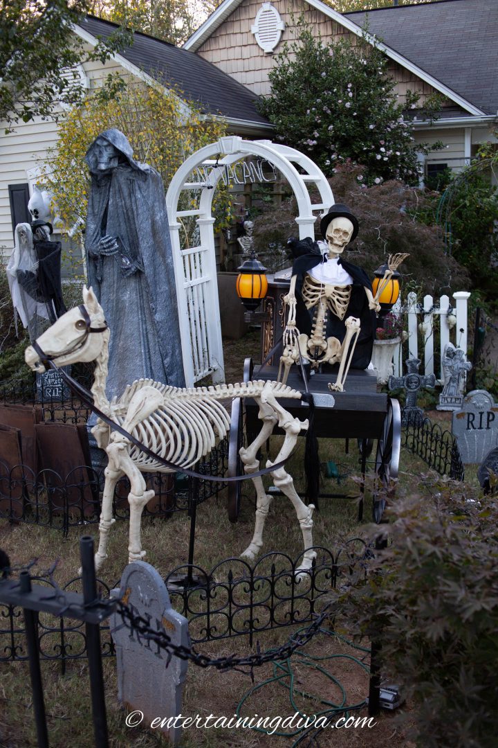 Skeleton horse and hearse carriage in a Halloween yard haunt