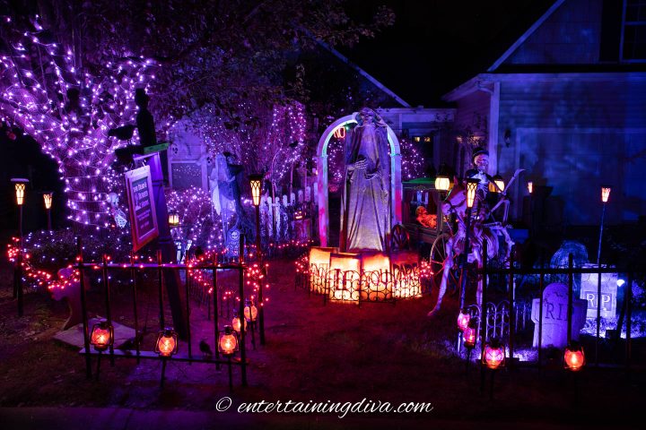 Halloween yard haunt lit up at night