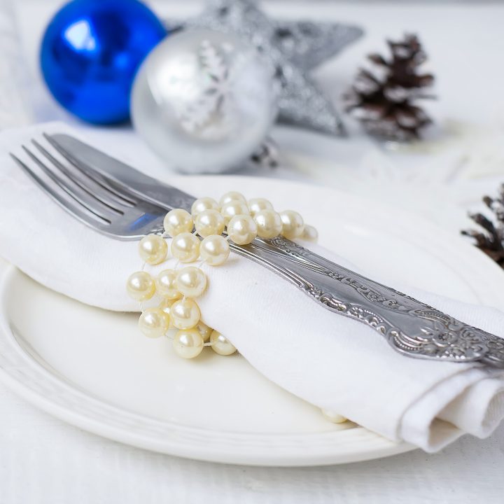 Christmas table setting with faux pearls used as a napkin ring
