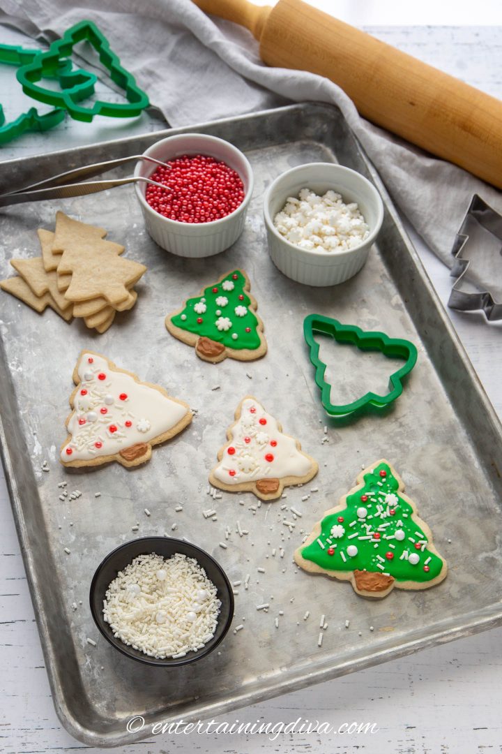 Christmas tree sugar cookies with cookie decorating supplies