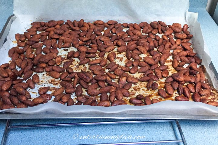 Tamari roasted almonds on a cookie sheet on a cooling rack
