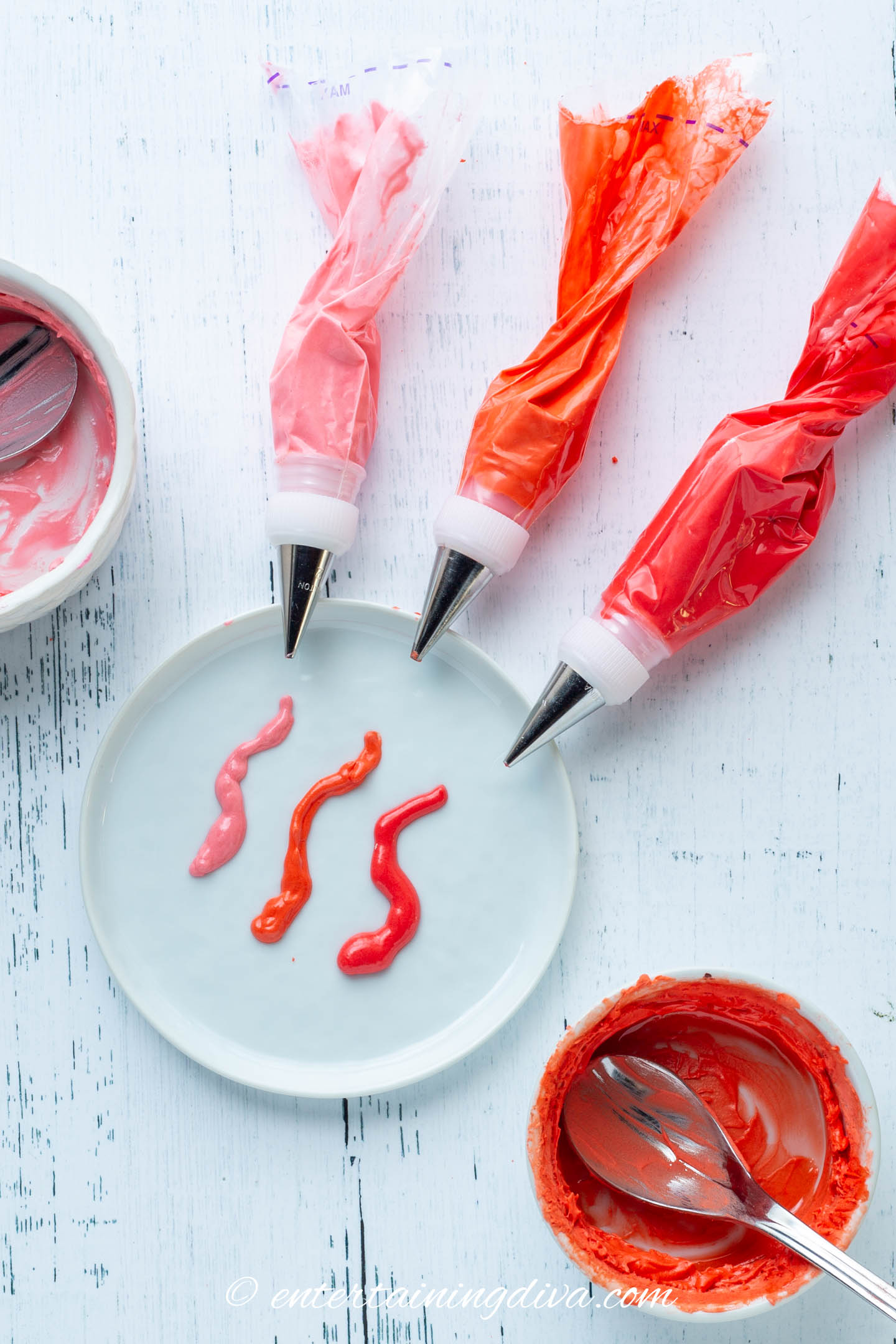 Red royal icing in piping bags