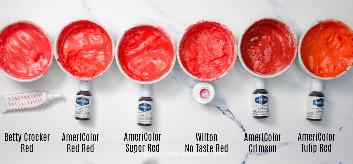 multiple bowls with different shades of red royal icing made with different red food coloring brands (Betty Crocker, AmeriColor and Wilton)