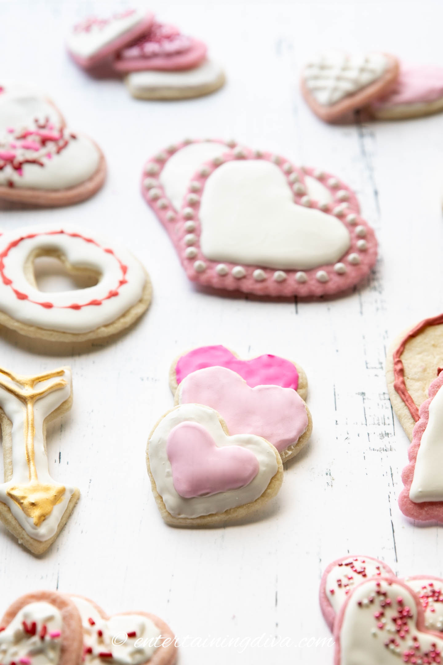 Assorted Valentine sugar cookies decorated with pink, white, red and gold icing