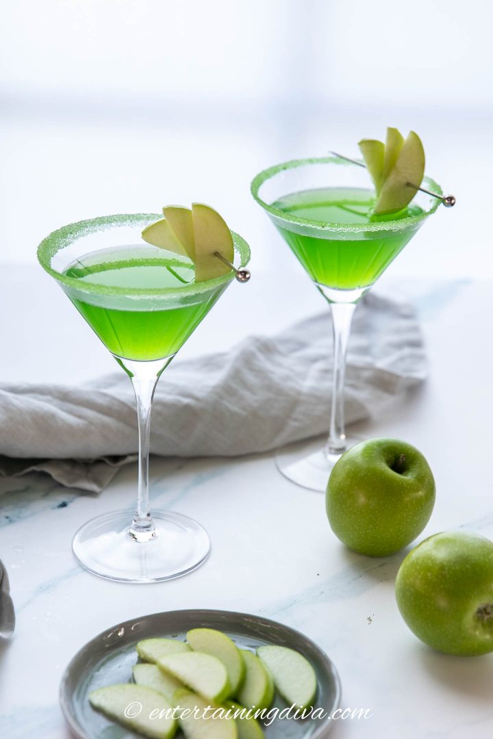apple martini mocktail with apple wedge garnishes