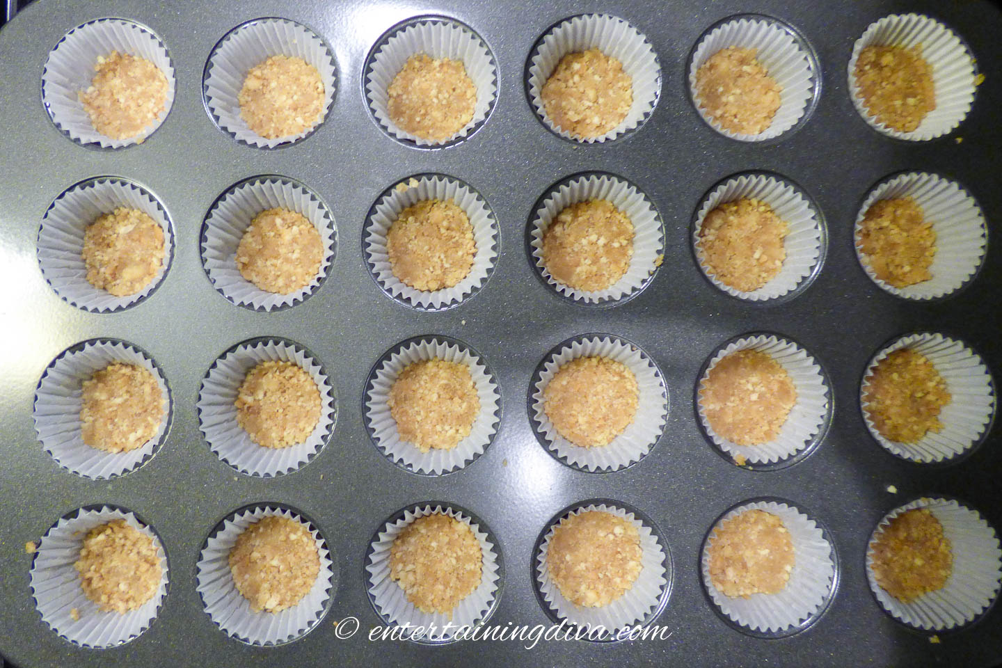vanilla wafer crust in the bottom of mini muffin tins