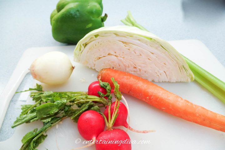 Coleslaw vegetables on cutting board