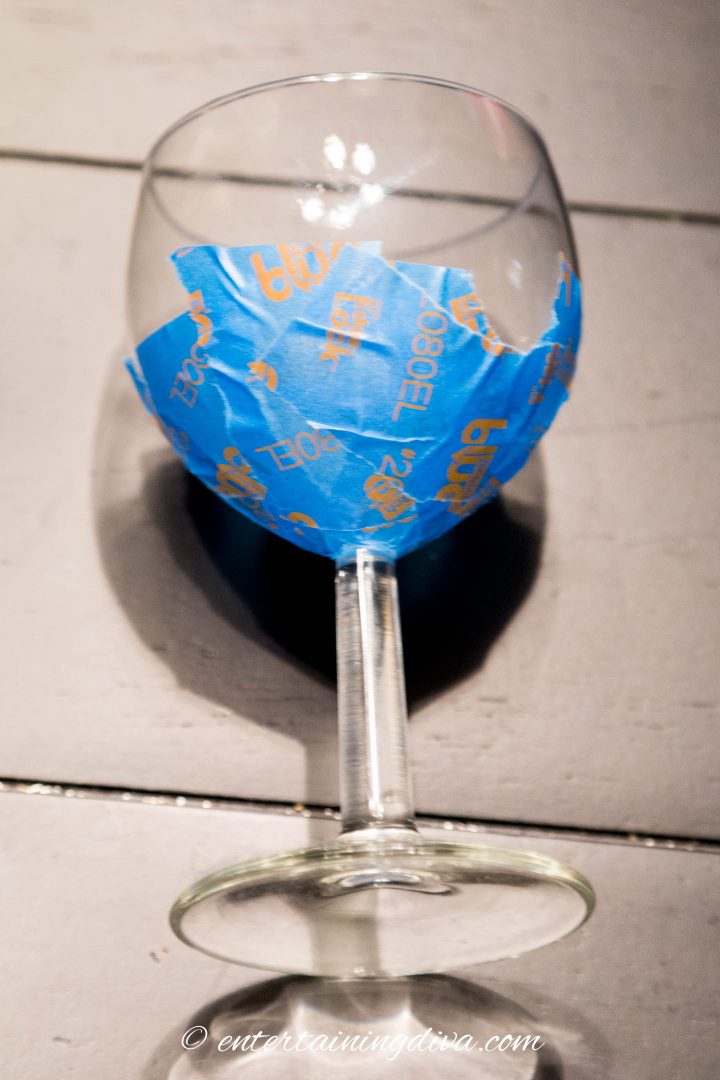 Side view of the bottom of the wine glass wrapped in tape