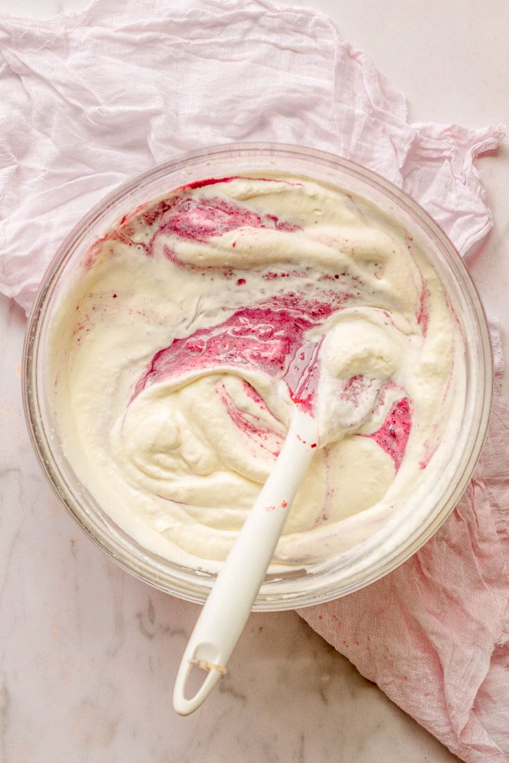folding berry mixture heavy cream with a spoon