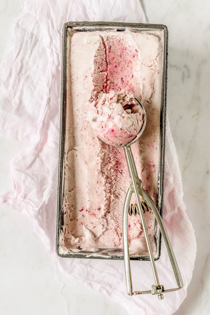 top view of ice cream being scooped out of pan with scoop