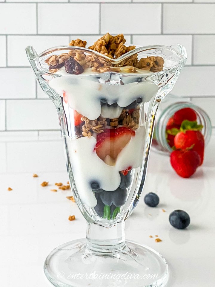 A glass of strawberry blueberry yogurt parfait