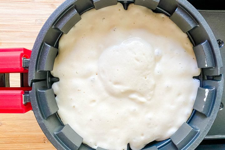 First layer of waffle batter in the waffle iron