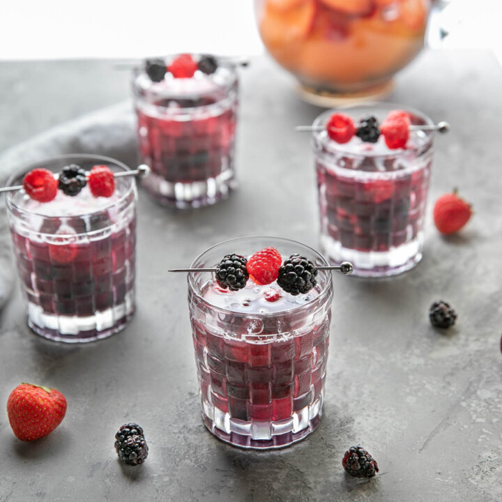 triple berry sangria served with frozen berries instead of ice