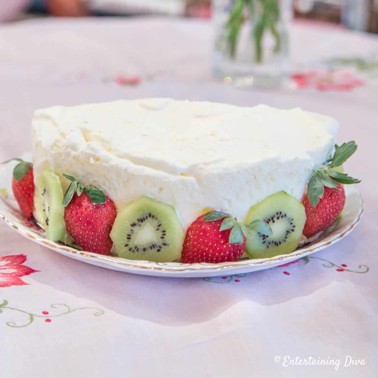 Frozen lemon mousse with strawberries and kiwi garnish