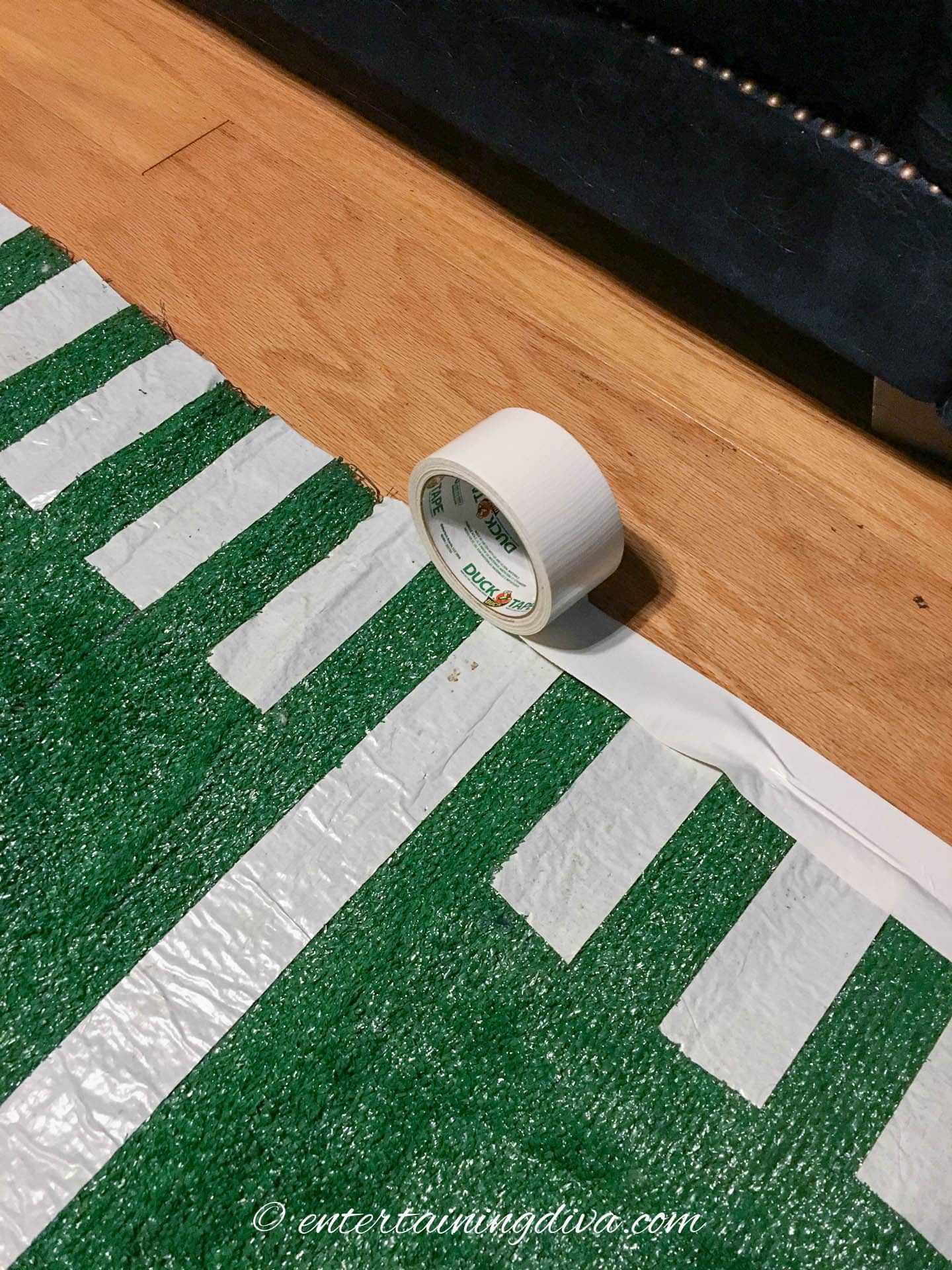 Taping the rug to the floor