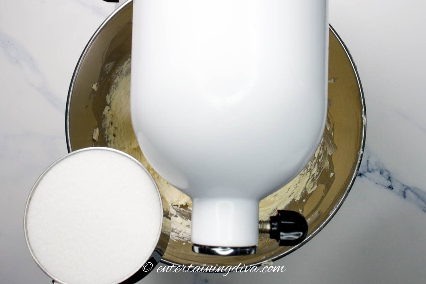 Sugar being added to the butter mixture