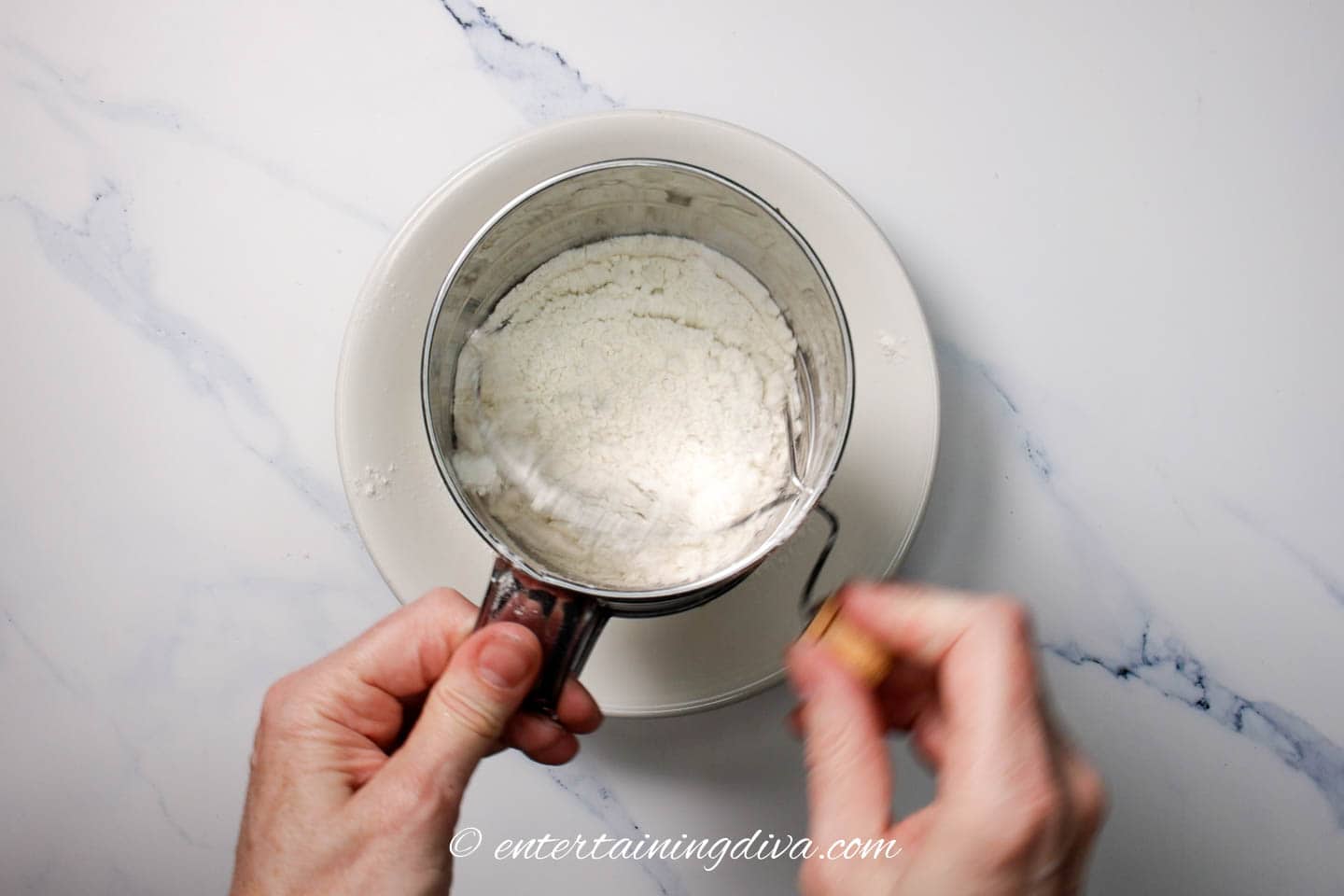 sifting powdered sugar with a sifter