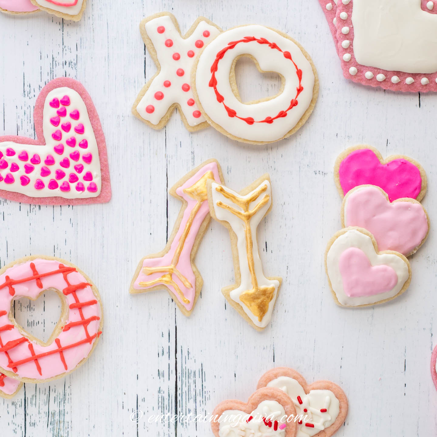 Assorted Valentine sugar cookies decorated with pink, white, red and gold icing
