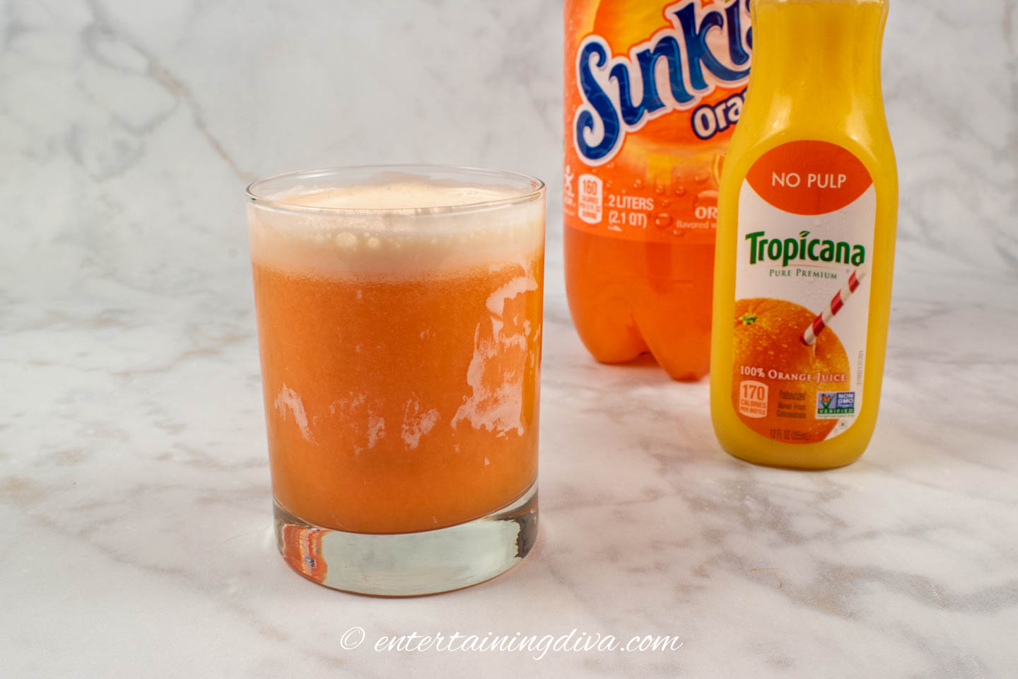 creamsicle cocktail after adding orange soda