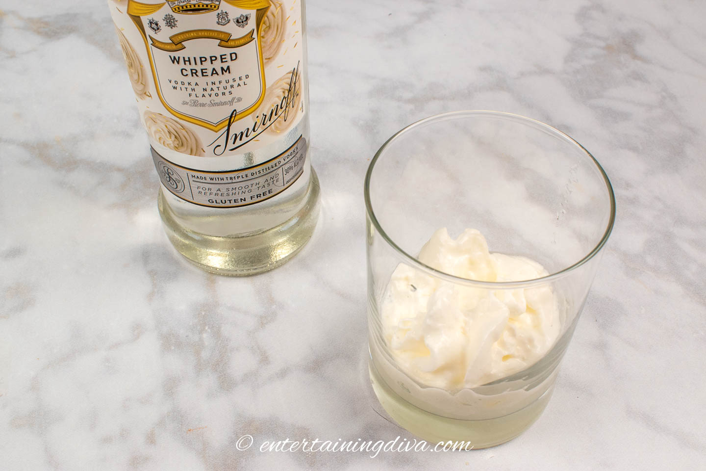 vodka and whipped cream in a glass