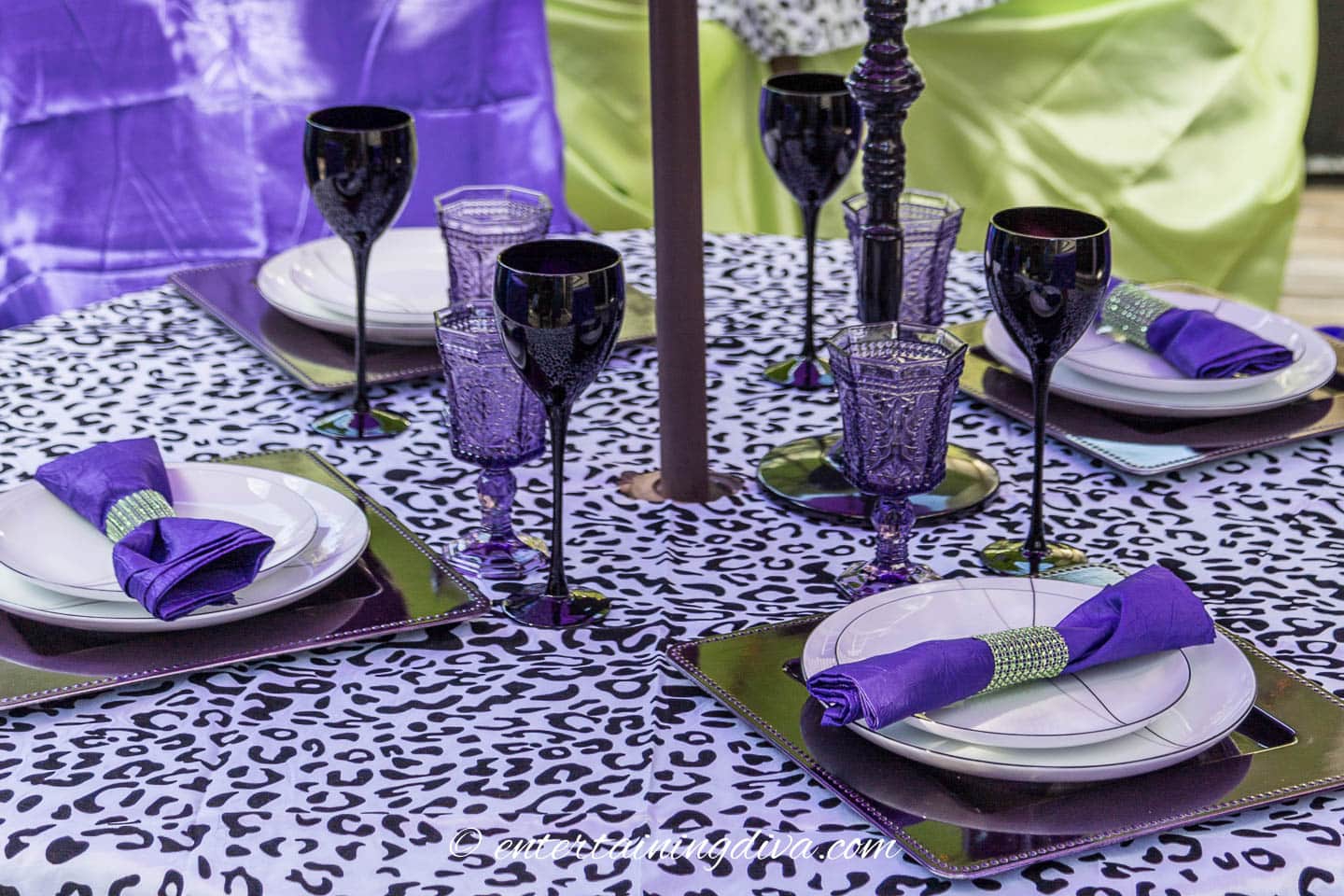 Black and white table setting with a black and white leopard print tablecloth