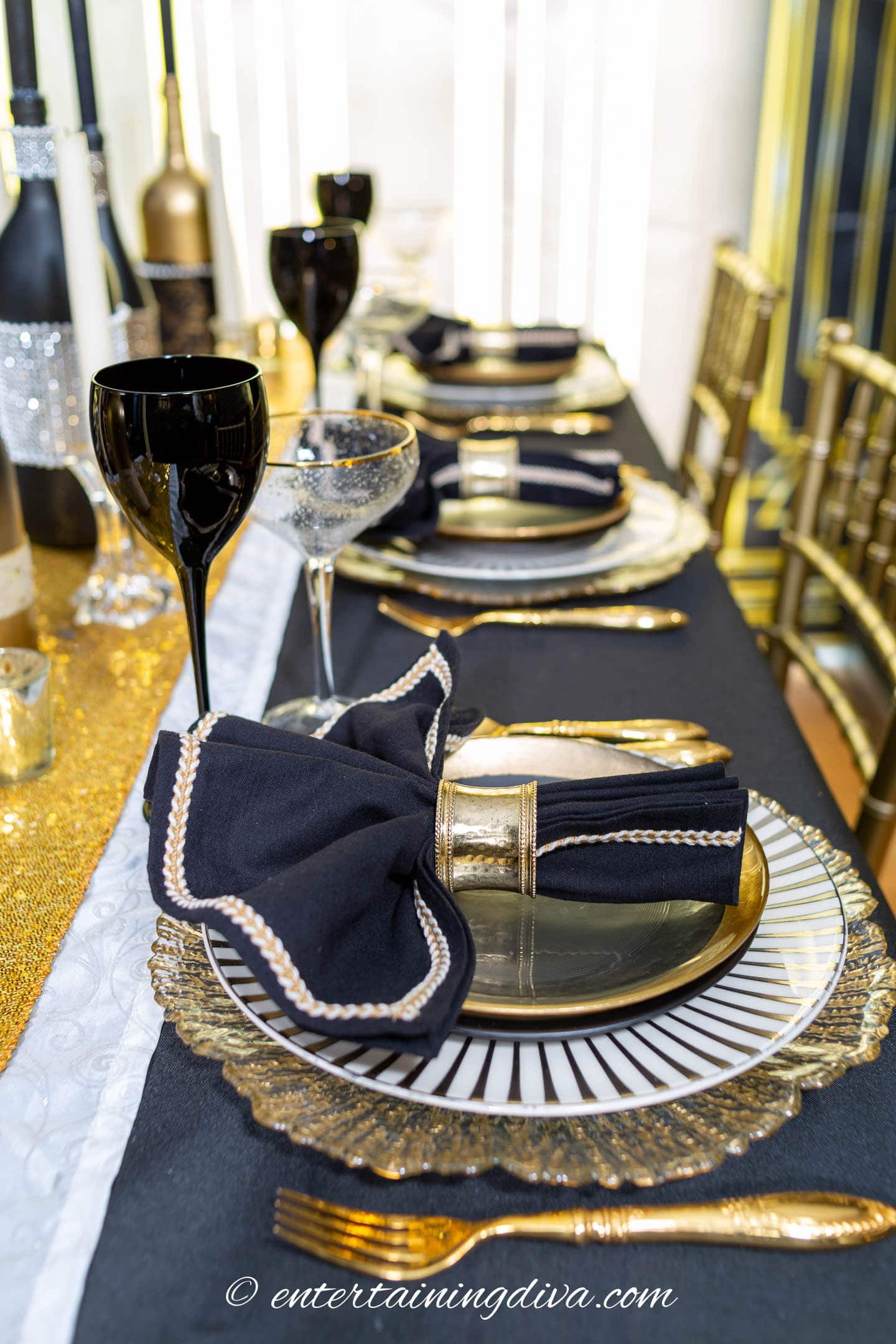 Great Gatsby party table setting with black, white and gold