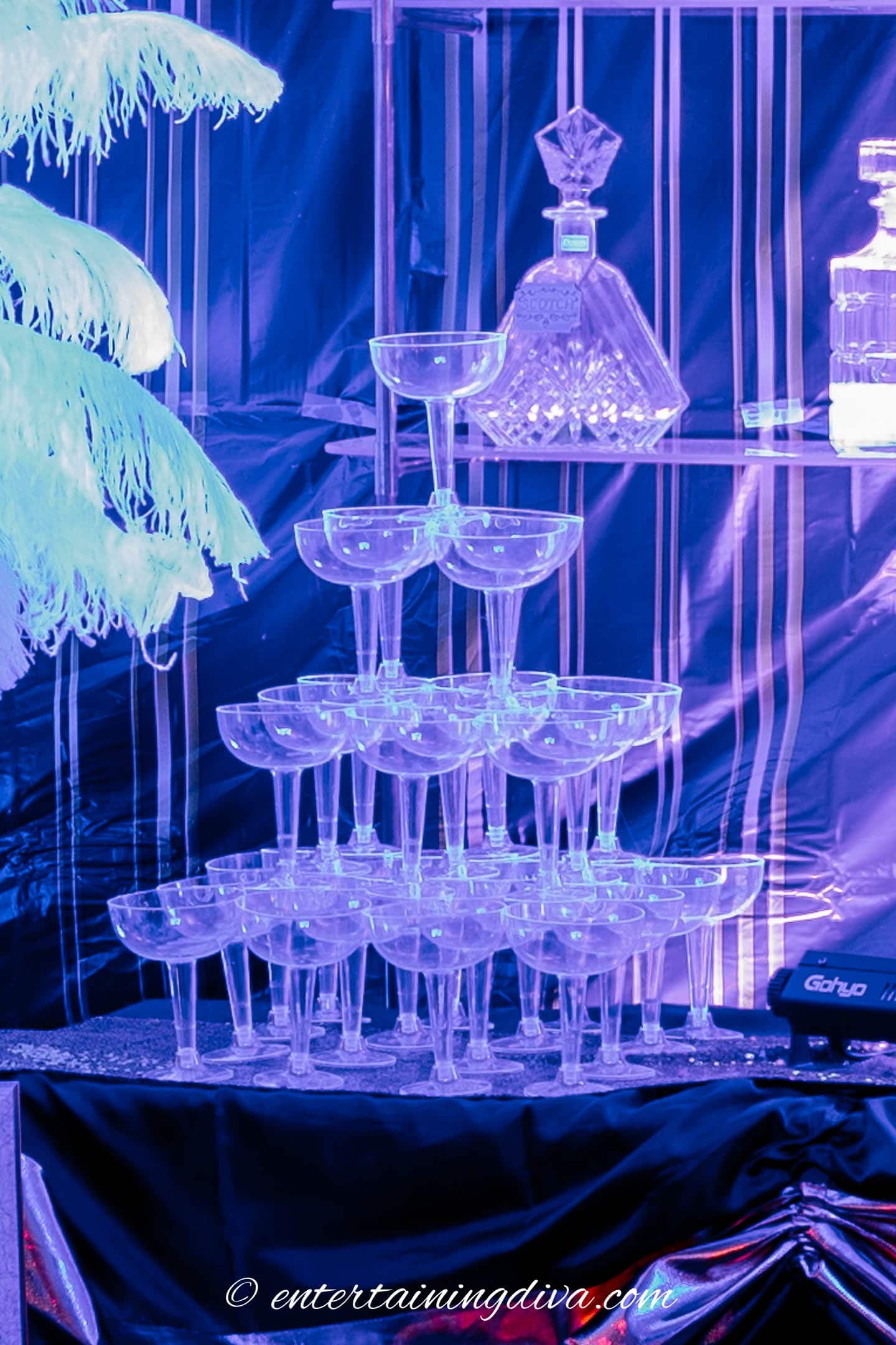 champagne glass tower made with plastic coupe glasses