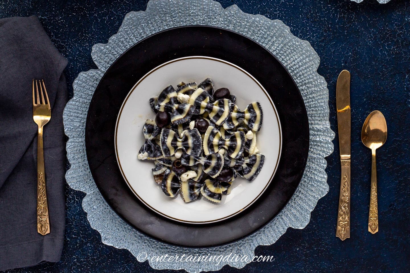black and white pasta salad on a black and white table setting