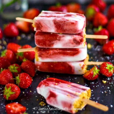 a stack of coconut milk and strawberry popsicles