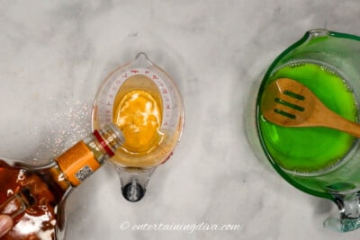 Fireball being poured into a measuring cup