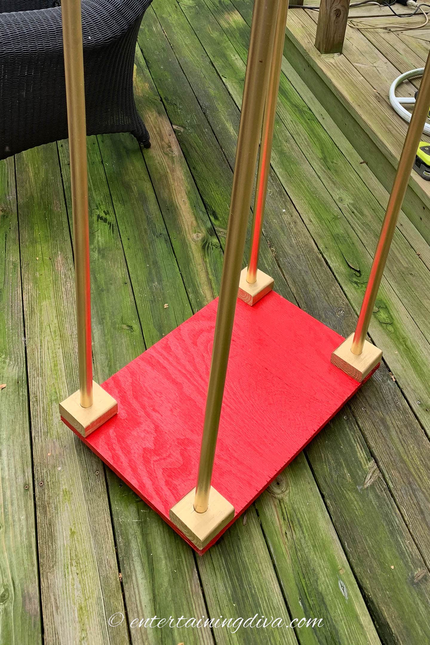 Gold posts attached to the DIY Halloween bellboy cart