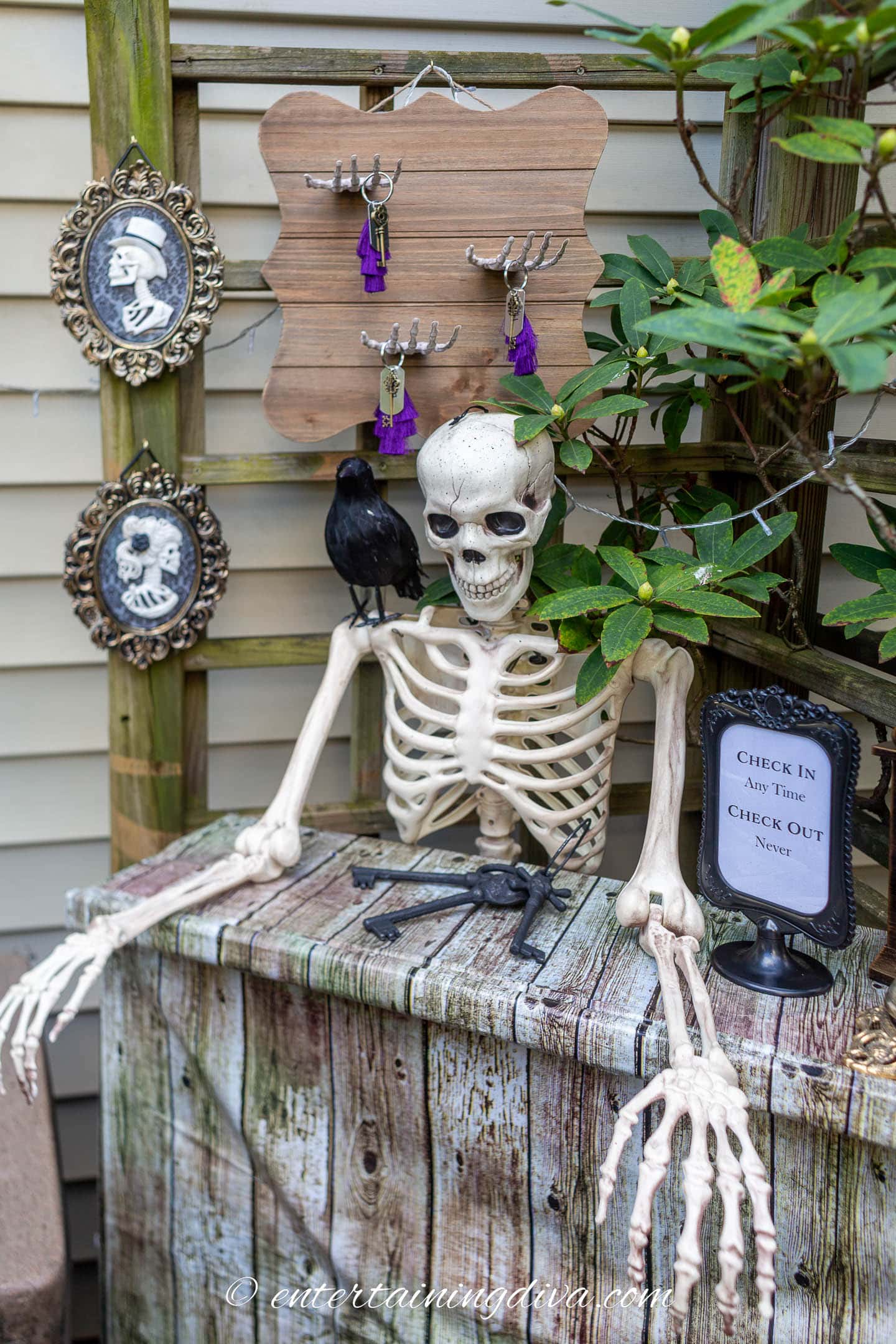 Skeleton behind a Halloween haunted hotel concierge desk