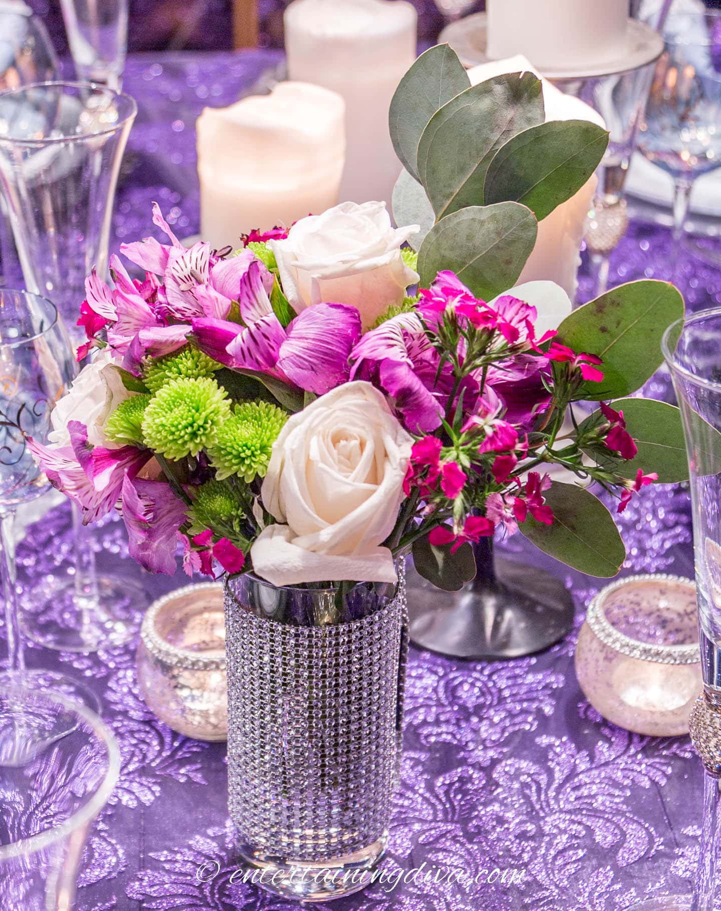 Close up of a purple, green and white floral arrangement used on an elegant Halloween tablescape