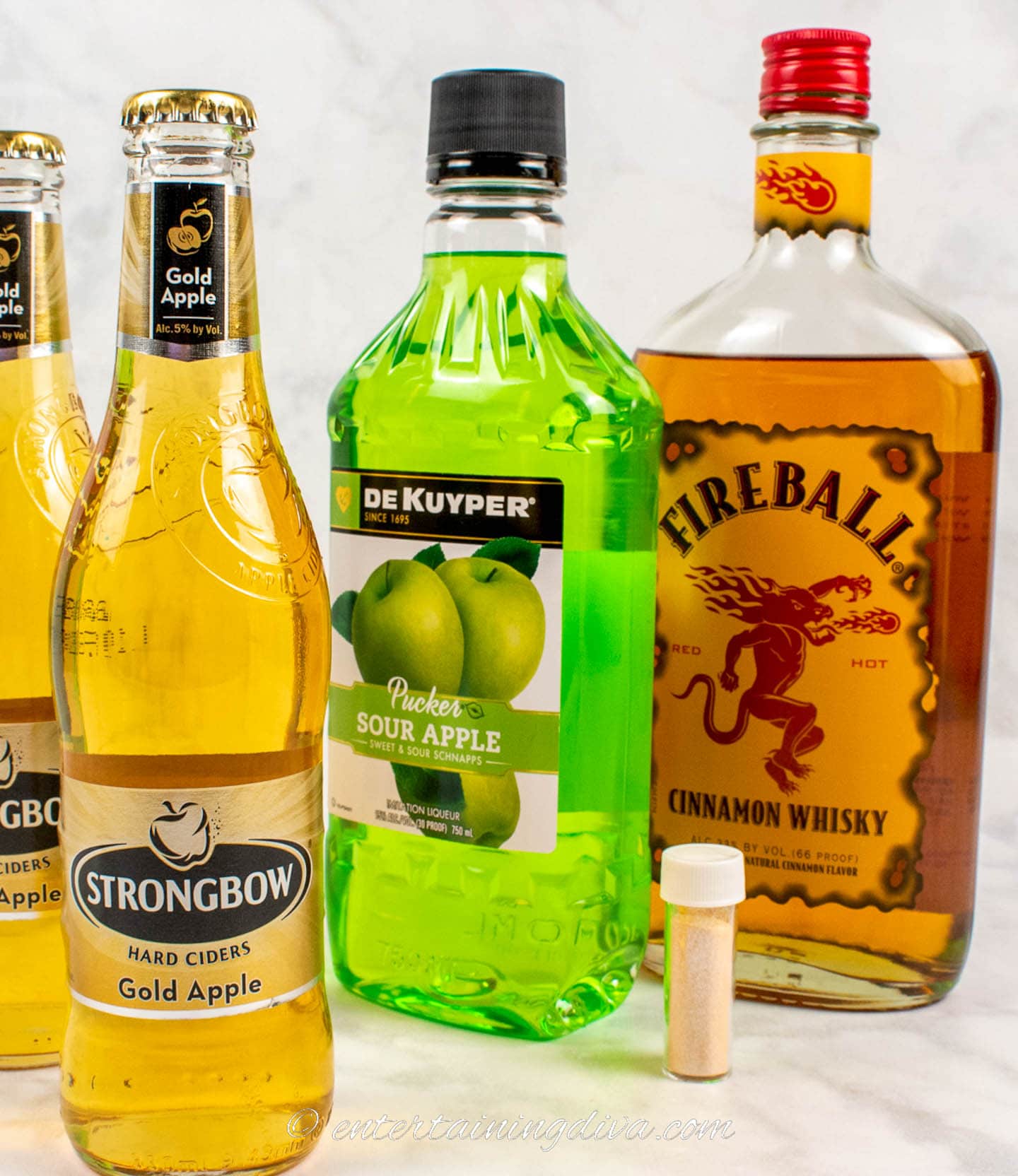 fireball hard cider cocktail ingredients - hard apple cider, apple pucker, fireball whisky and gold glitter