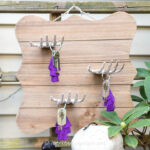 DIY skeleton hands Halloween wall decor with keys hanging from them