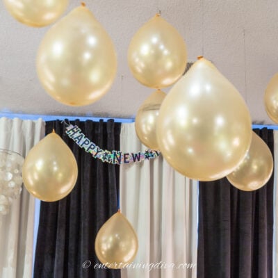 Balloons hanging from the ceiling for New Year's Eve decor