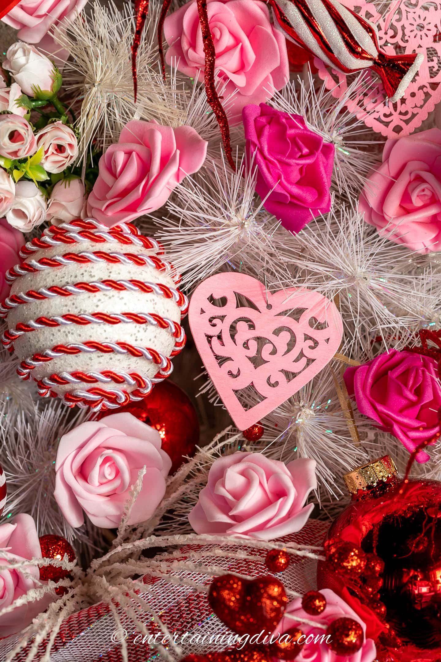 Close up of a Valentine's Day tree with pink roses as ornaments