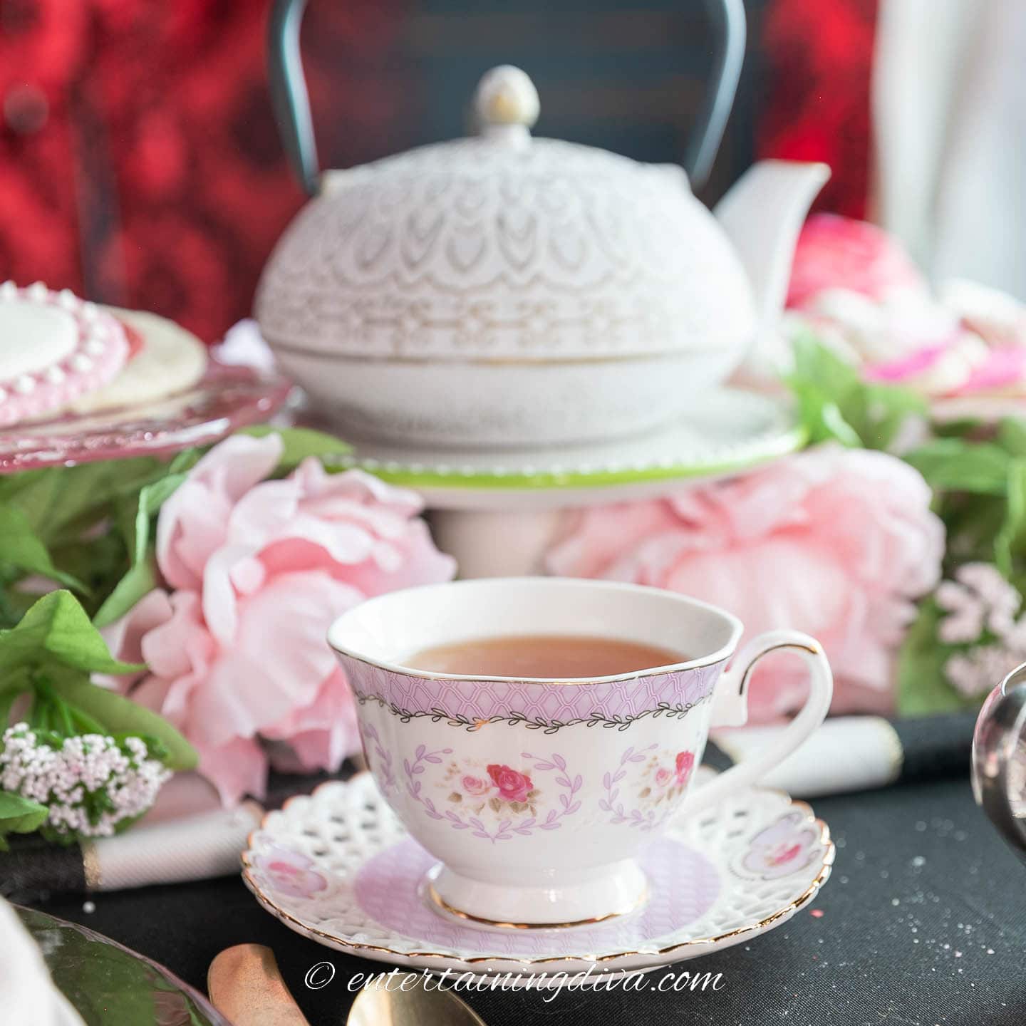 teacup and saucer in front of a teapot at a Valentine tea party