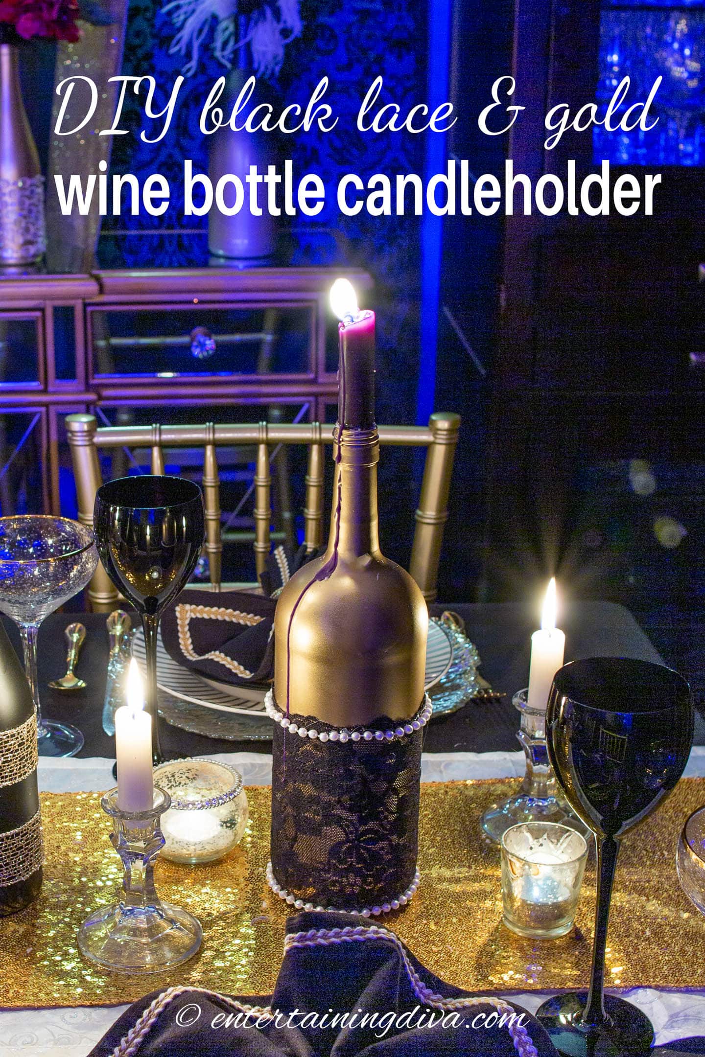 DIY gold wine bottle with black lace and pearls used as a candle holder for a table centerpiece