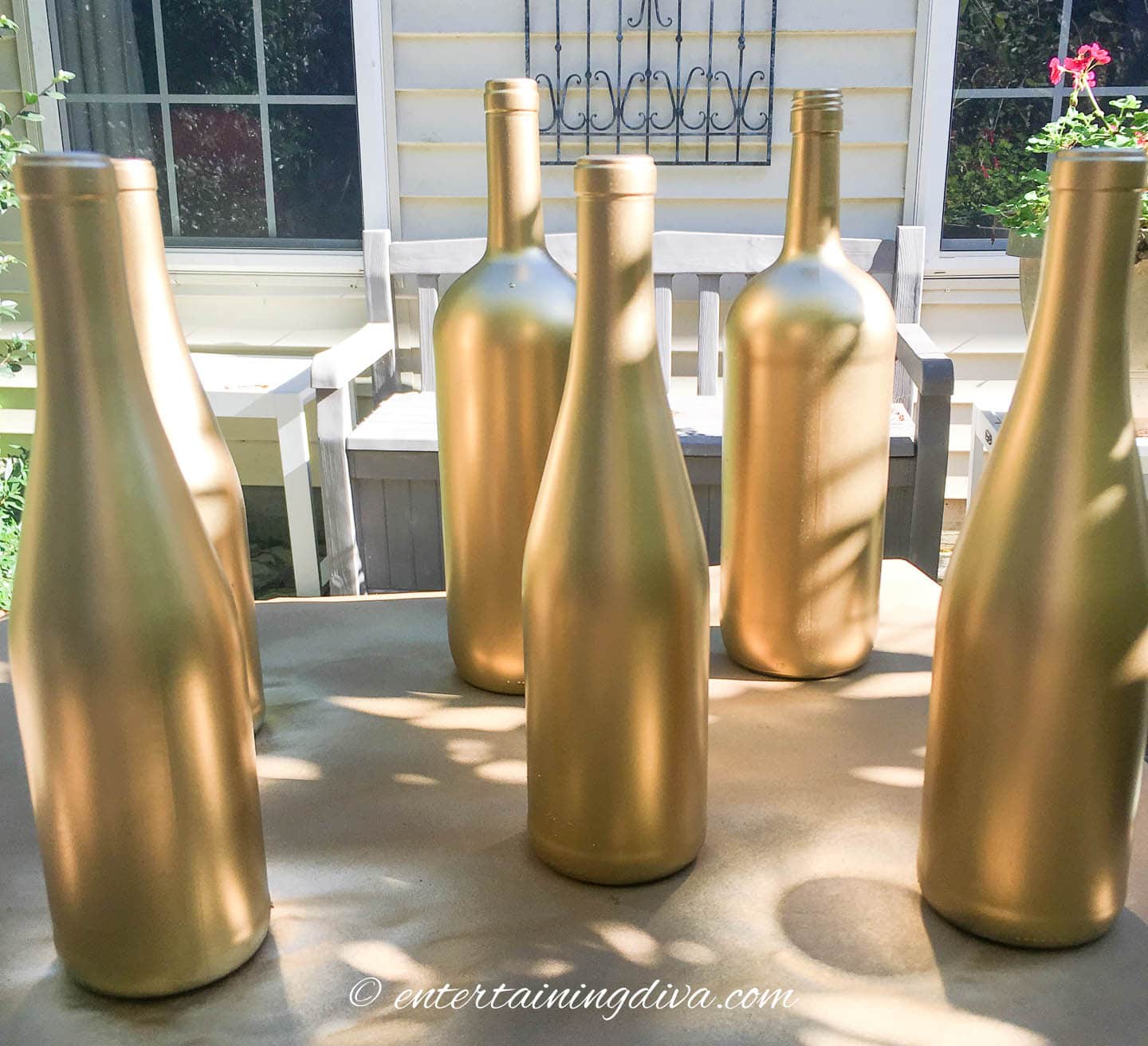 wine bottles spray painted gold