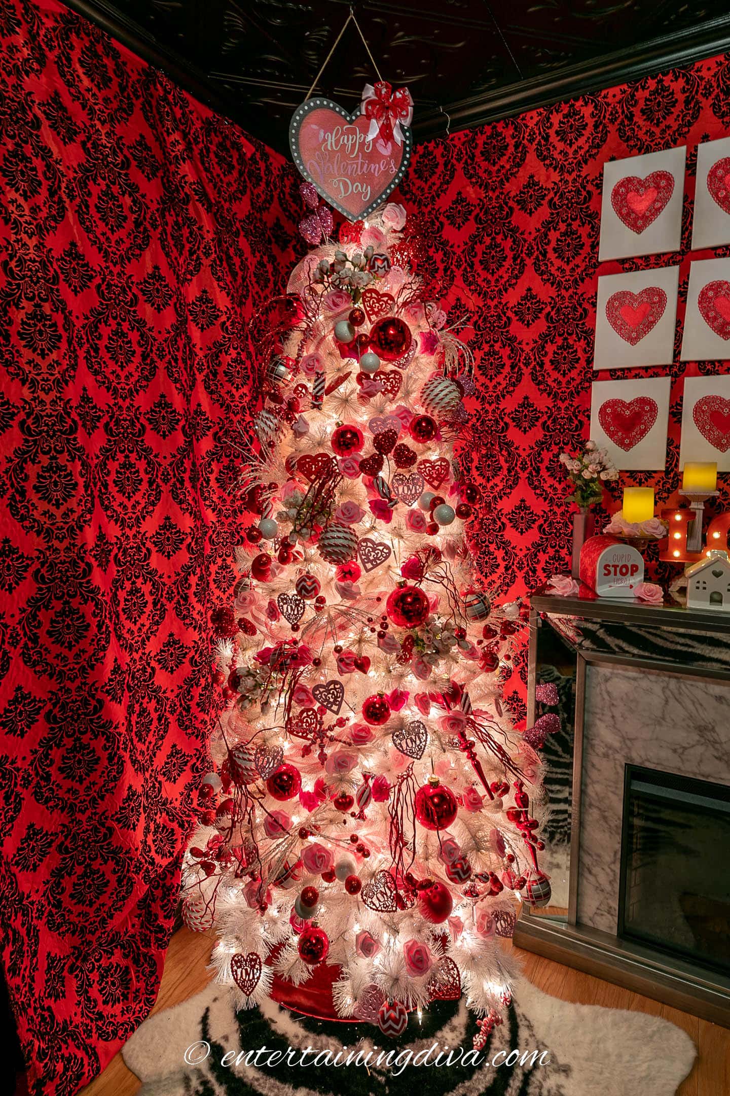 Pink, red and white Valentine tree in front of a red and black wall