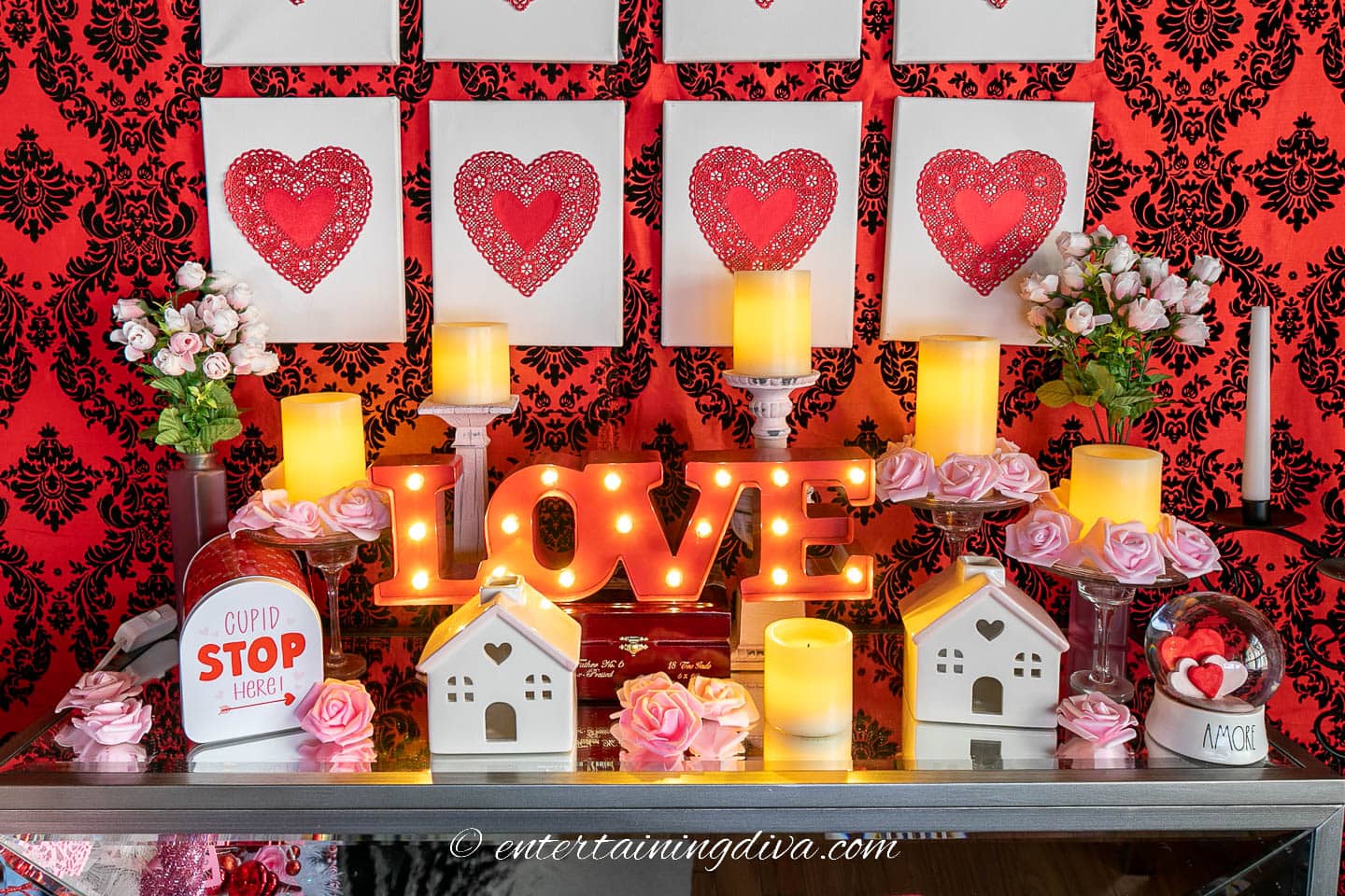 DIY Valentine's Day decorations including flameless candles and faux roses on a mantel
