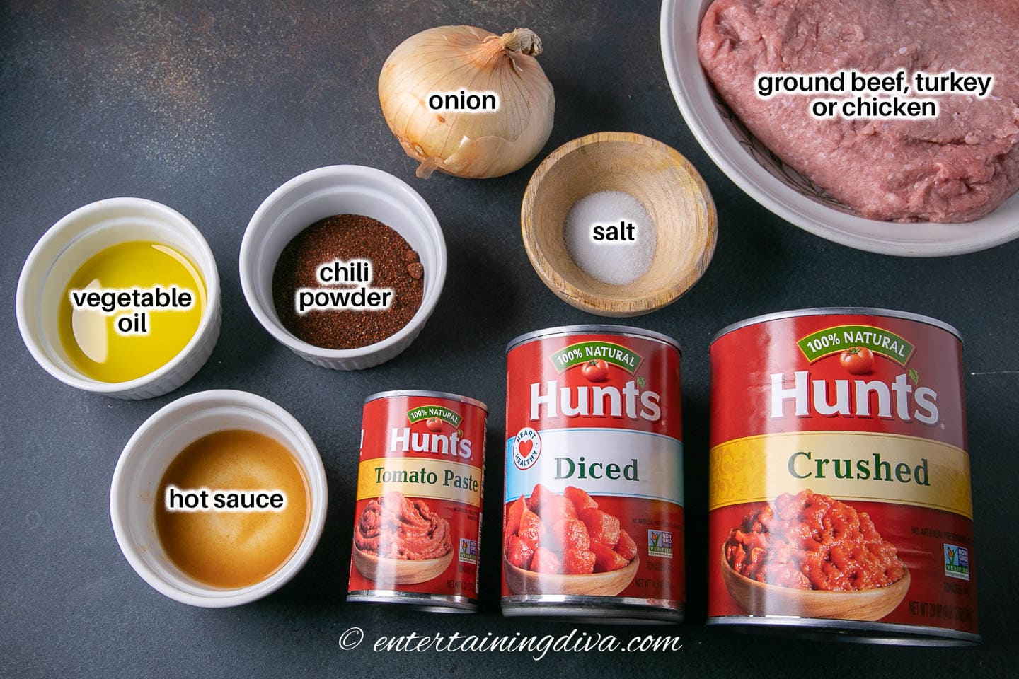 crock pot no bean chili ingredients - ground beef, turkey or chicken, crushed tomatoes, diced tomatoes, tomato paste, chili powder, salt, onion, hot sauce, vegetable oil