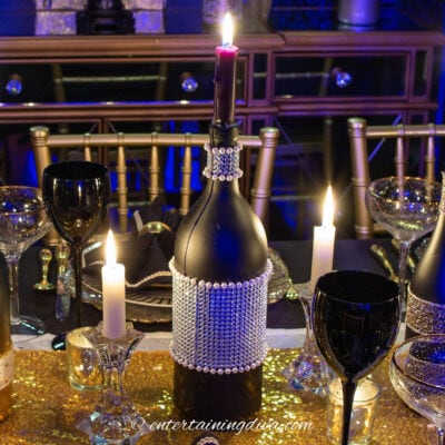 DIY wine bottle candleholder with silver ribbon and pearls