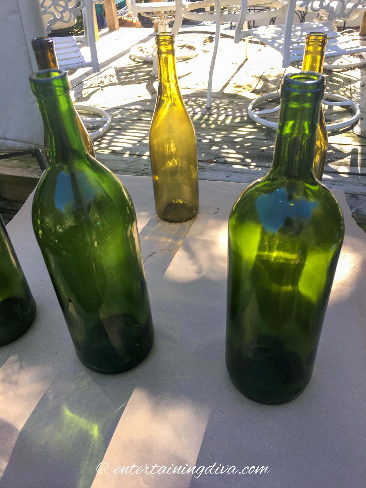 Wine bottles spread out on a piece of cardboard