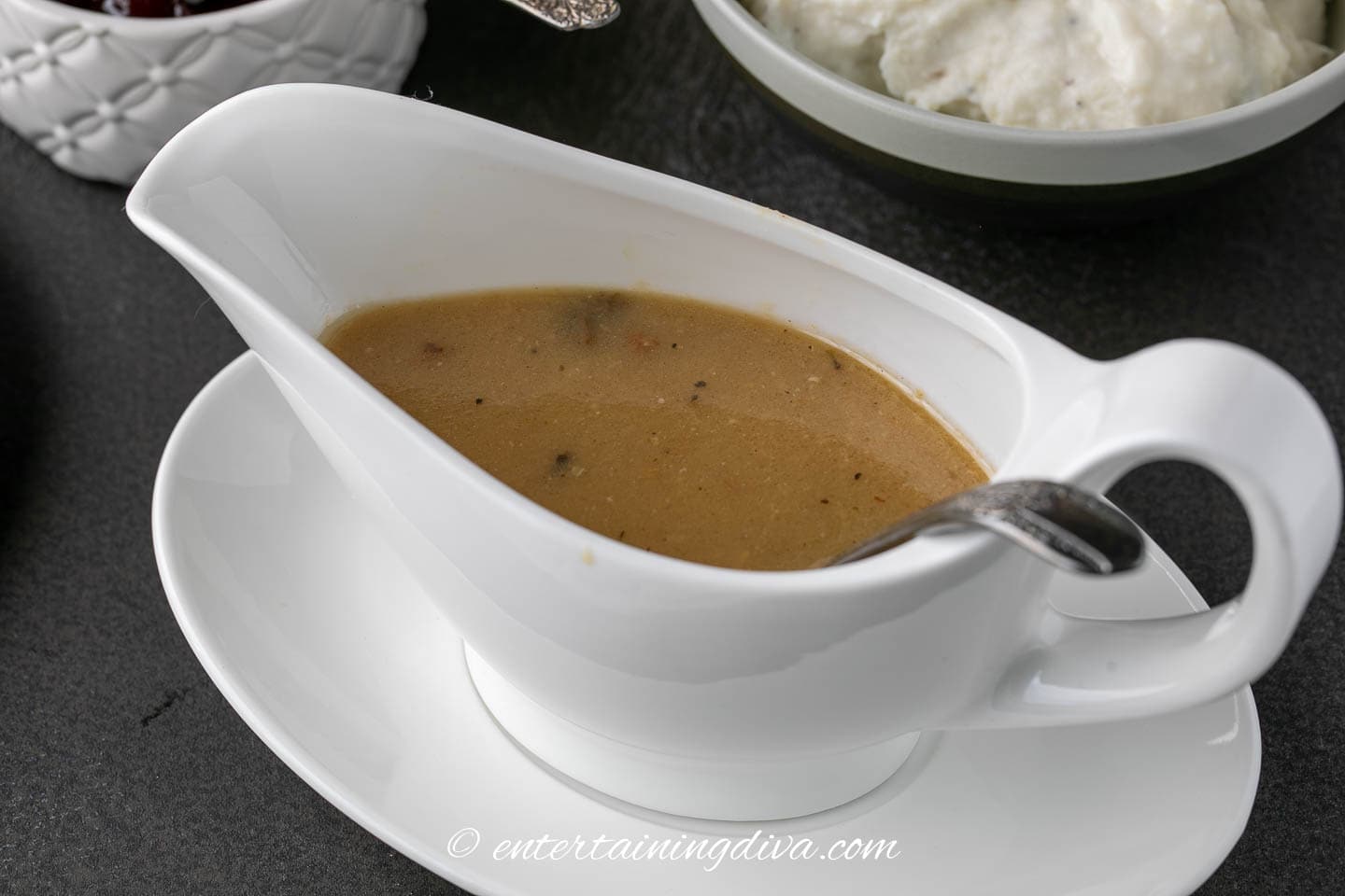 turkey gravy in a white gravy boat