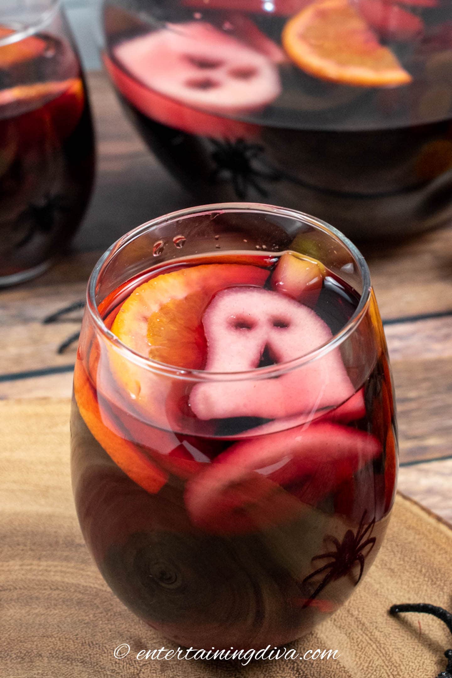 Dark red Halloween sangria with a ghost floating on top