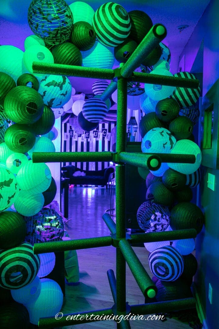 Beetlejuice party entrance with purple and green lights